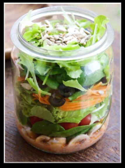 When building your jar salad, start with your favorite dressing on the bottom of a jar or container. This keeps your delicate greens from getting too soggy.