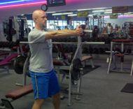 length. Push your hips back and swing the Kettlebell or dumbbell between your legs.