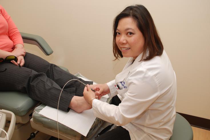Dr. Nguyen uses the PinPoint FootLaser to treat toenail fungus.