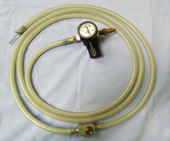 a hand-operated jet injector (Figure 8) attached to central wall oxygen, tank oxygen, or the fresh gas outlet of an anaesthesia machine; or may be controlled with the oxygen flush valve of an