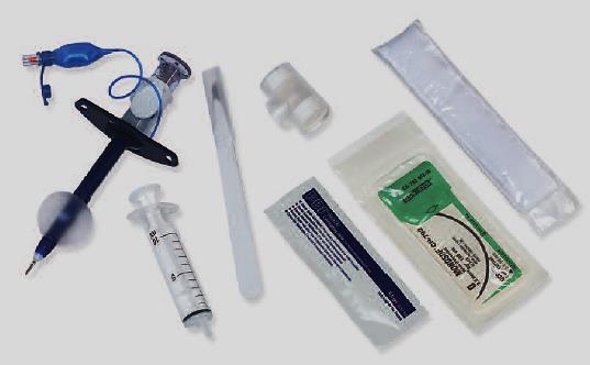 Figure 14: Cricothyroidotomy kit for patients requiring airway support and ventilation: Small cuffed tracheostomy tube, syringe, scalpel, T-piece, lubricant gel, suture, tracheostomy tape hand