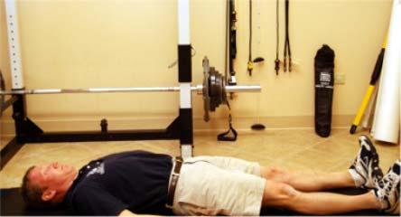 1. Stretching hamstrings a. Test Lie on your back with your legs out straight in front of you.