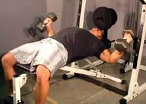 One of his favorite pec movements was dumbbell flyes, but he had a certain way of doing them-only moving through the bottom third of the stroke.