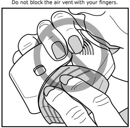 Do not block the air vent with your fingers. See Figure G.