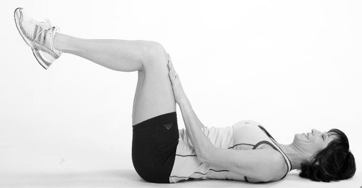 With lumbar spine remaining in neutral squeeze the buttocks, not by extending the hips.