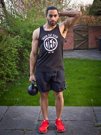 Hold a kettle bell in one hand and shrug your shoulder up to lift the weight. Keep your shoulders pulled back throughout.