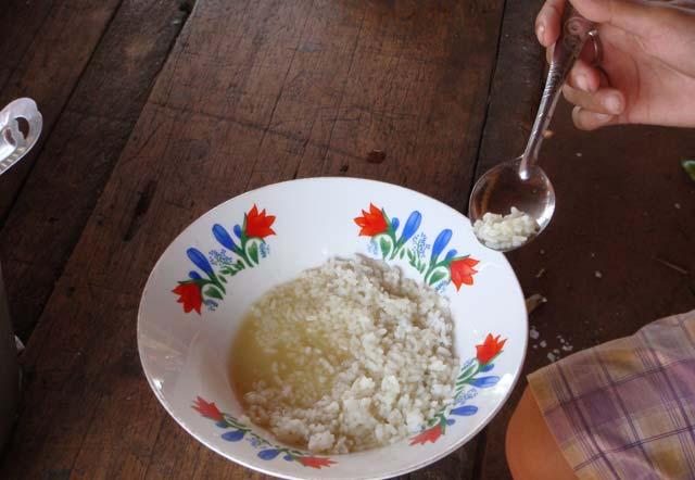 THREE EXAMPLES OF DIFFERENT HOMEMADE FOODS BEING FED TO CHILDREN IN CAMBODIA ABOVE: PLAIN