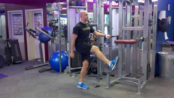 Hold dumbells in each hand if needed. Place the instep of one foot on a bench.