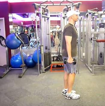 Workout B Reverse Lunge Stand upright holding a pair of dumbbells