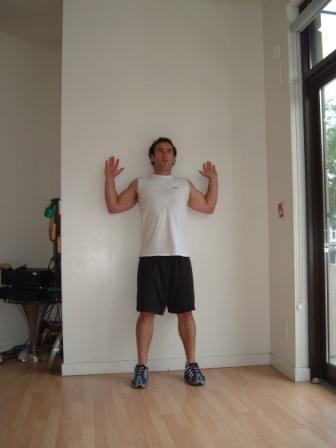 Workout D Stick-up Stand with your back against a wall.