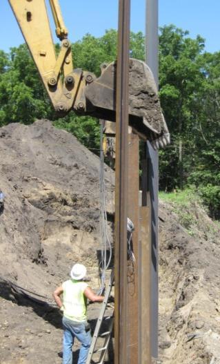 No pile bearing capacity was specified as the sheet pile sections act as a backfill retention and scour protecting structure in this application.
