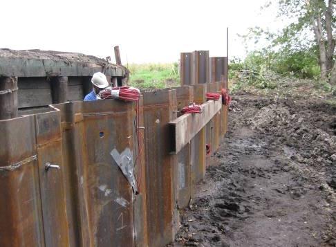 6 ft 38.33 ft 10 ft Beam-in-slab bridge Existing abutment Sheet pile wall Rip-rap trench Backfilled regions E Figure 5-26.