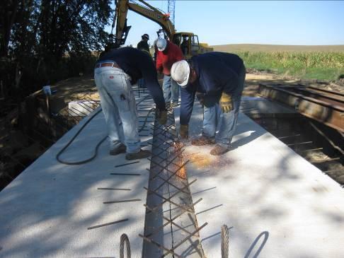 element. Concrete for each joint was poured after exposed reinforcement was trimmed and tied into position as shown in Figure 5-31.