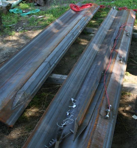 Angles welded over gages Exposed gages Figure 5-33. Sheet pile instrumented with vibrating wire strain gages.