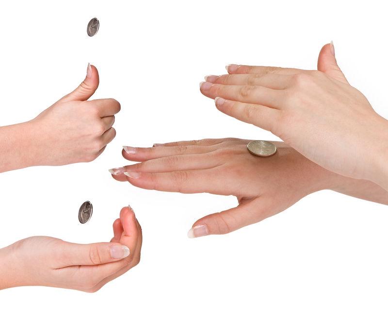 FIGURE 6.7 Tossing a Coin. Competitions often begin with the toss of a coin. Why is this a fair way to decide who goes first? If you choose heads, what is the chance that the toss will go your way?