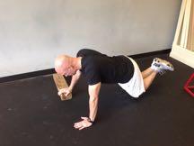 Keep your upper body in a straight line at all times, keeping your knees on the ground (use a mat if needed).