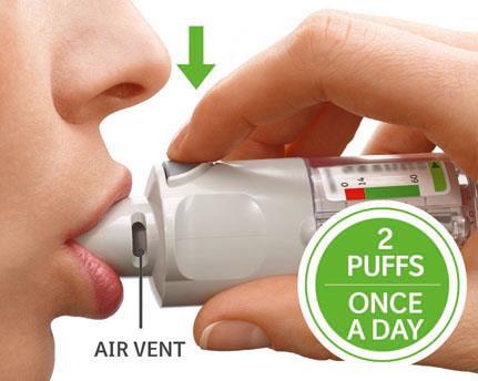 While taking a slow, deep breath through your mouth, PRESS the dose-release button and continue to