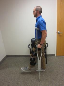Standing Up: 1. Sct frward in the chair t make it easier t stand. 2. Hld bth crutches in ne hand, n the side f yur surgical/injured leg. 3.