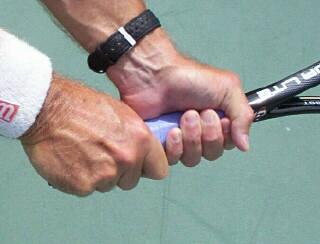 Get a good grip on your racquet to minimize stress on your
