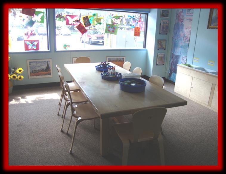 Here is the art room. If I sit in a chair, I can color or draw and make pictures. Imagination Playground is in the gym.