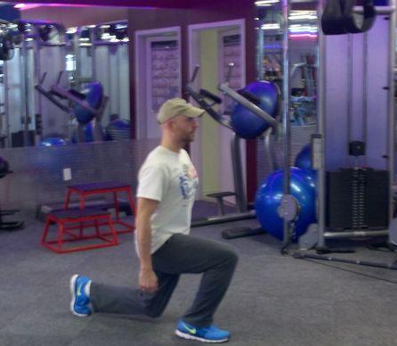 Switch Lunge Stand with your feet shoulder width apart, holding dumbbells at your sides