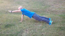 Do four Superman push-ups by extending one arm out after