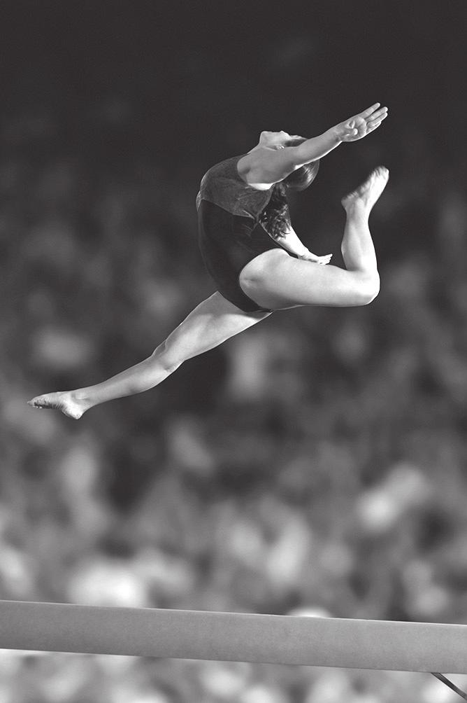 19 Figure 3 shows a gymnast during her routine on the balance beam.