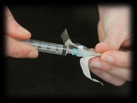 To open needles in plastic packaging, press and turn the top (green, see arrows), and