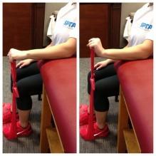 Next, stepping on one end of the Theraband, curl your wrist up against resistance.