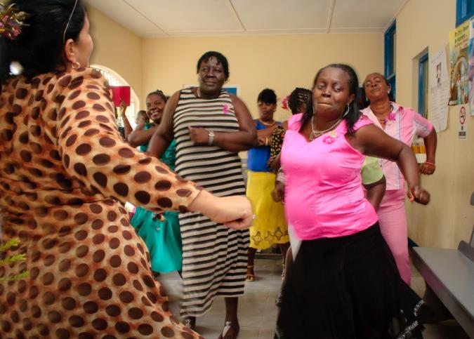 Primary care Doctor dances with her 'class' of clients with diabetes