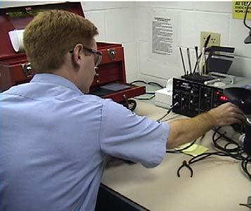 The technicians in the 2M Microelectronics Shop maintain and repair micro-miniature electronics parts used in aircraft for Using a pinch grip to grasp objects and leaning over work for long periods