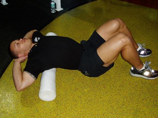 Thoracic Foam Roller Place a 3 or 4 foam roller perpendicular to your spine at the point slightly below your shoulder blades or where you feel the restriction begin. Cradle your neck with your hands.