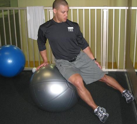 QLO Side Bend To get properly positioned, roll down the ball from a sitting position into a supine position and then