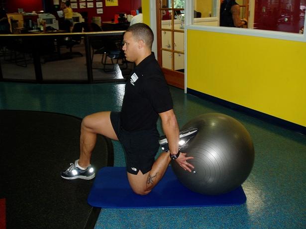 Rectus Femoris Begin in a sprinter s start position with the foot and ankle of the leg to be stretched on the ball.
