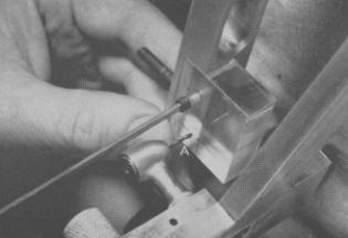 216 Lee J. Pros. Dent. August, 1969 Fig. 8. A blank axis record block is being placed in the position previously occupied by the right axis alignment block on the upper face-bow.