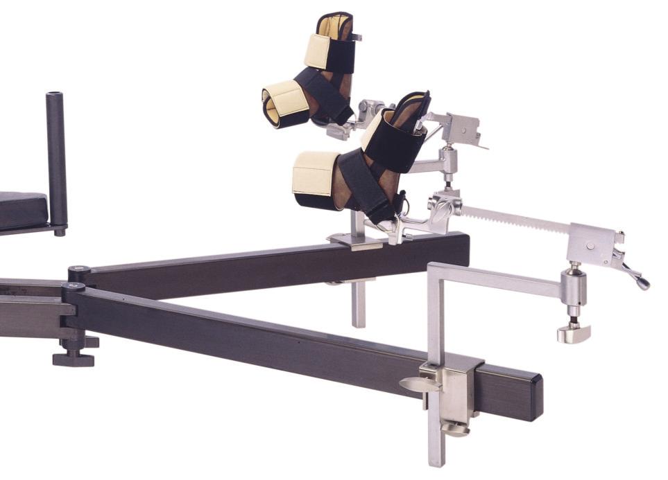 Tabletop translates 4 inches horizontally to either side to facilitate patient transfer and increase C-arm accessibility. Translation can be actuated and locked from either side of the table.