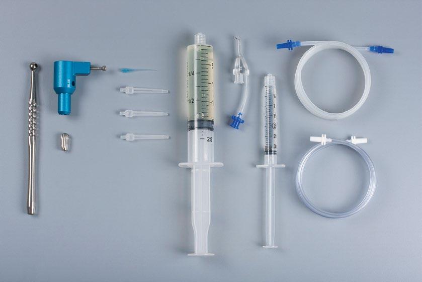 Figure 2 The components of the EndoVac system: the Master Delivery Tip (MDT) accommodates different sizes of syringes, the macrocannula is attached to the autoclavable aluminium handpiece and the