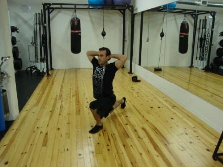 Step backward with one leg, taking a slightly larger than normal step.