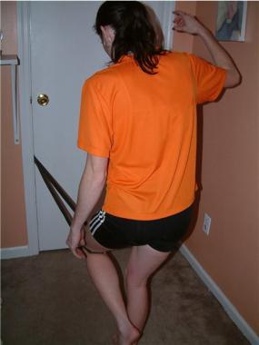 Strengthening with Theraband (left and below): Loop one end and close in the door.