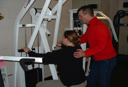 EXECUTION Provide assistance with pulling or pushing the handles to complete the exercise.