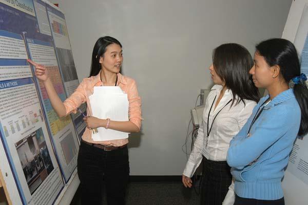 54th Annual Meeting of the Iowa Section of the AADR (continued from page 5) Dr. Chaiyasri Thunpithayakul, Department of Operative Dentistry resident, explains her poster to Dr.