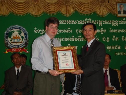 (Continued from page 3) Life and Hope in Cambodia (Above) Dr. Jon Ryder receives an award from the Cambodian secretary of state for his contributions to International University. Dr. Jon Ryder is also a photographer.