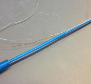11 Top, from left: (1) RF wire and RF thermocouple wire within heat shrink tubing, (2) Catheter body with RF electrode wire, RF thermocouple wire, and heat shrink