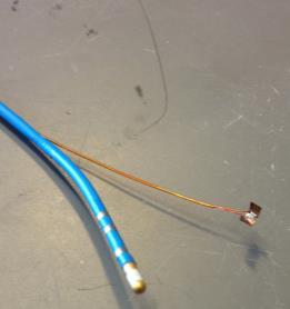 electrode and thermocouple wires, along with completed catheter tip. Bottom: Catheter with heat shrink tubing ready for RF electrode attachment. L.