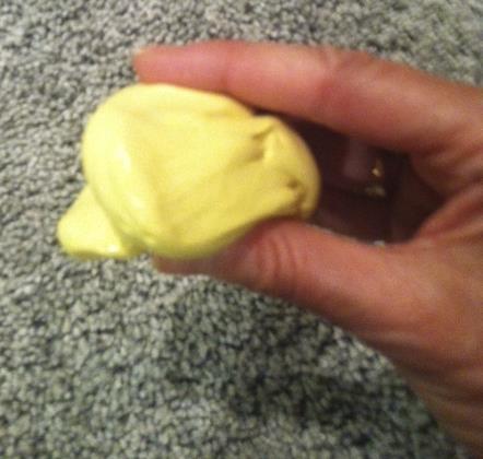 Putty Pinching Ball up the putty and place it in between your thumb and fingers.