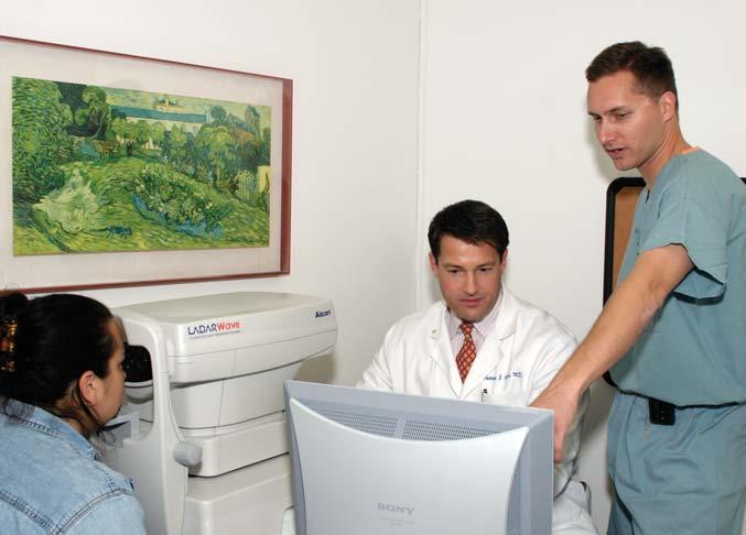 72 Programs Treatment Centers Dr. Anthony Aldave (left) and Dr. Rex Hamilton (right) with a patient in the UCLA Laser Refractive Center.