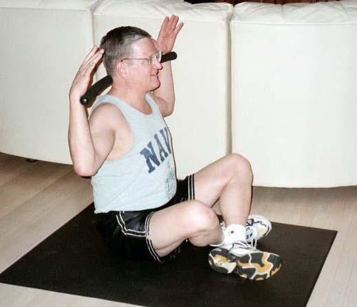 Stretch by Lateral Flexion Start in a seated position with legs crossed.