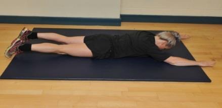 shoulders towards your thighs while keeping the lower back on the floor.