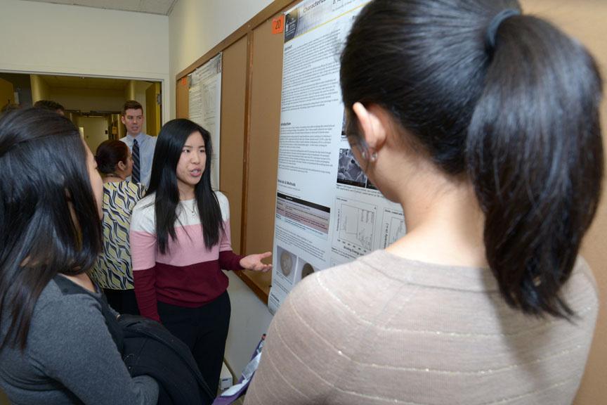 Page 6 Local Research Day, Pt. 2, continued from page 5 (Above): Deborah Yu (D3) explains her poster, Characterization of a Polydopamine Coating on Dentin. Co-authors included her mentor, Dr.