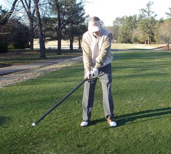 Swinging the Body Bar Flex for an Effective Stretch for your Back and Possible Improvement in the Consistency of your Swing Hold one end of the Body Bar Flex bar as you would your driver or long iron.